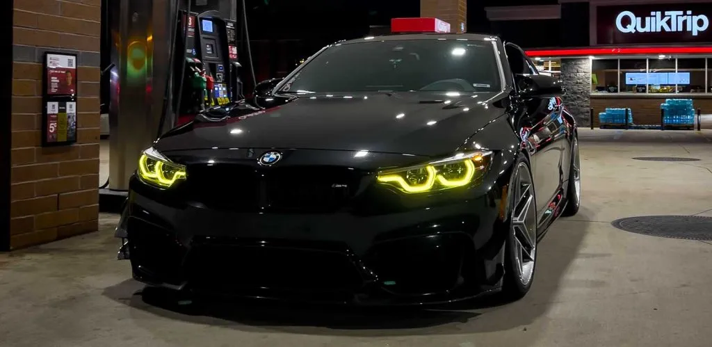 black bmw m4 with rgb dlrls