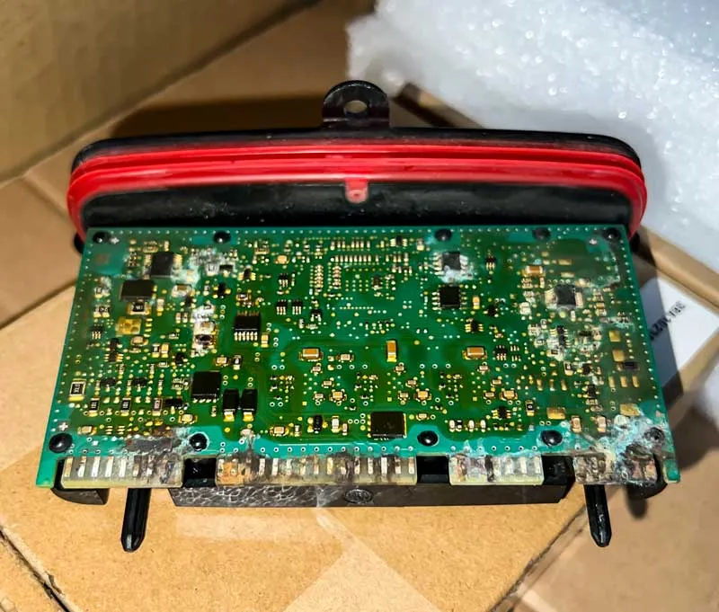water damaged BMW headlight module