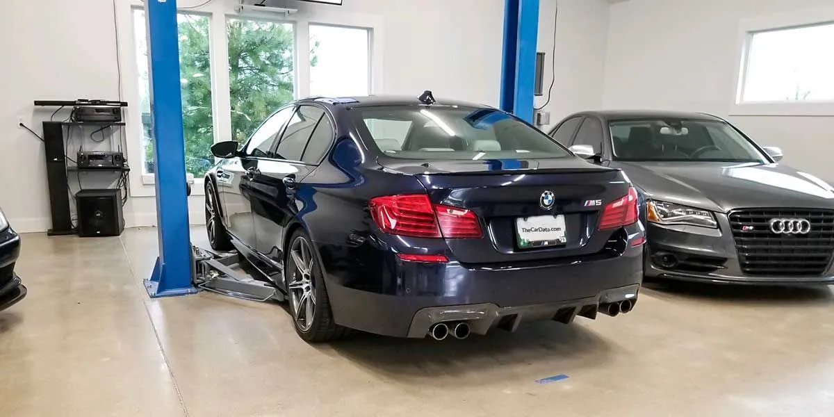 bmw m5 at a tire shop installing Michelin Pilot Sport 4S tires