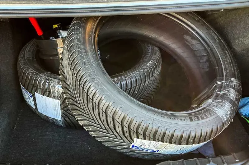 my Michelin CrossClimate2 all-season tires in the trunk of my car