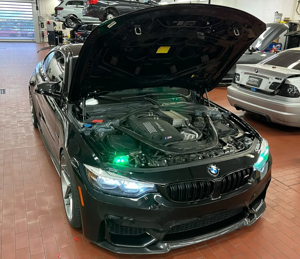 rgb headlight modules being installed and tested at BMW dealership