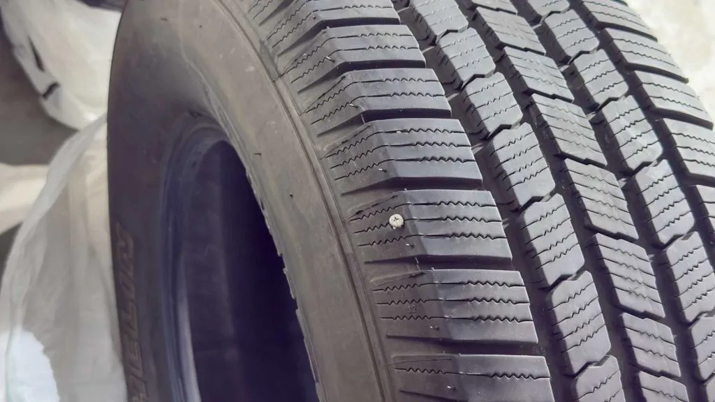 tire with a puncture caused by a screw