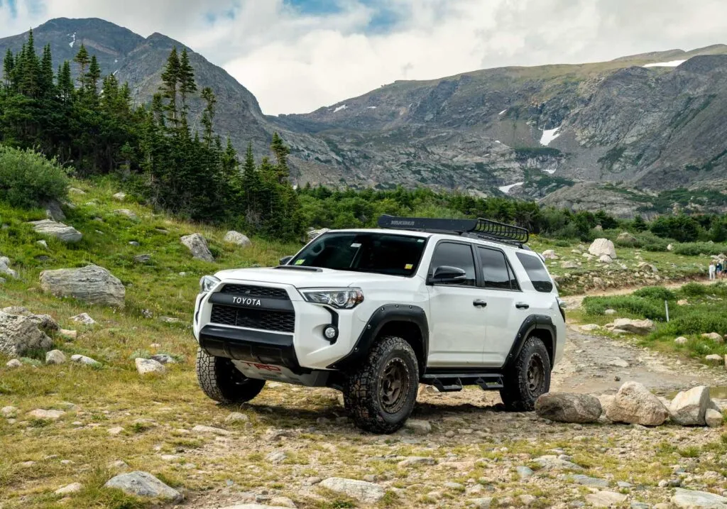 toyota 4runner with falken wildpeak at4w tires being tested on rocky off-road terrain